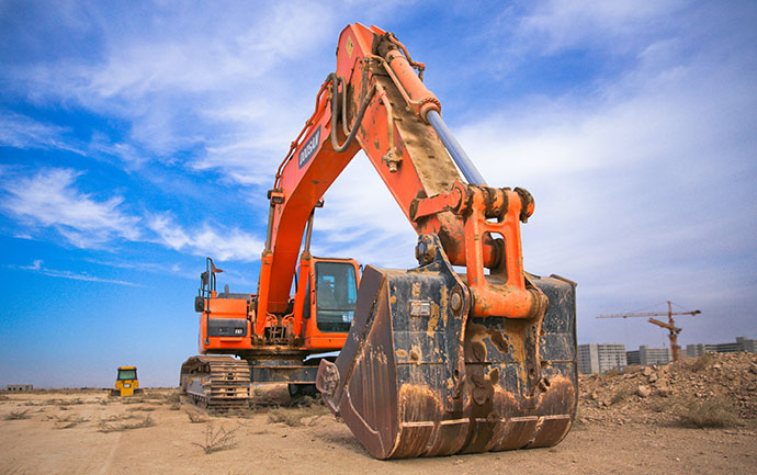 Orange digger and blue sky