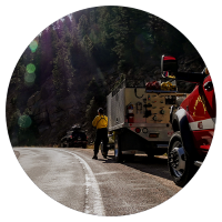 first responder vehicle on mountain road - circle