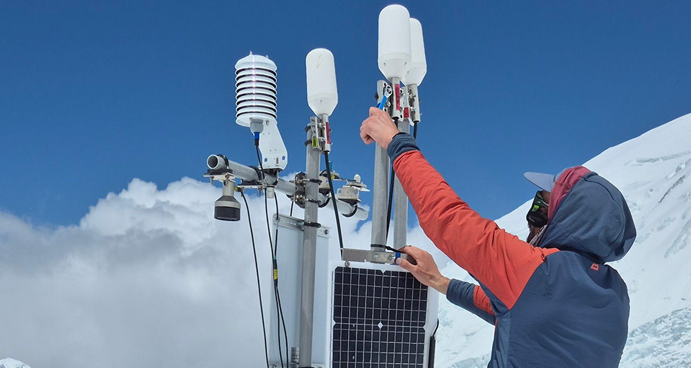 Image of team installing glacier melt tracking equipment