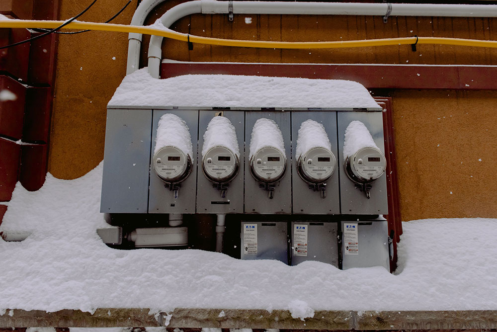 Image of industrial electricity meters in snow