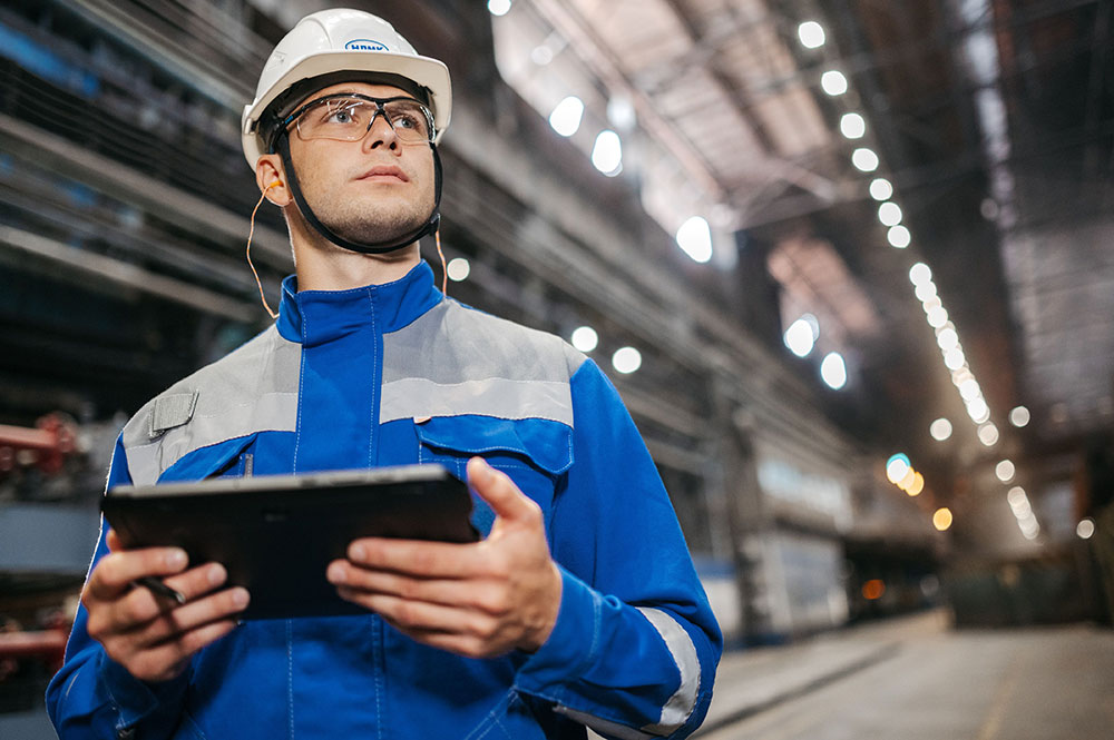 Utility Engineer Inspecting Tablet